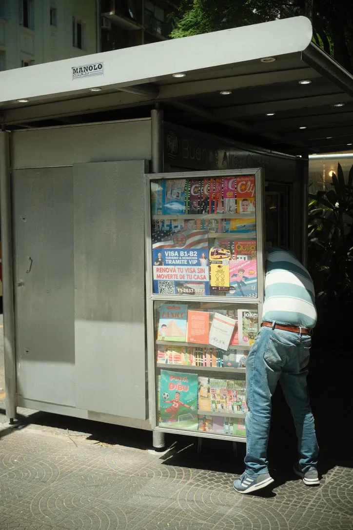 Newsstand kiosk packed with glossy magazines in Microcentro